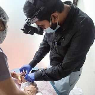 Dr mhatre examining premature born baby